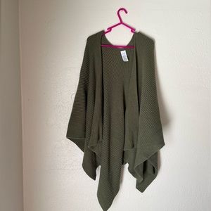 Women’s ribbed one size Shaw with no sleeve/arm holes. Army green